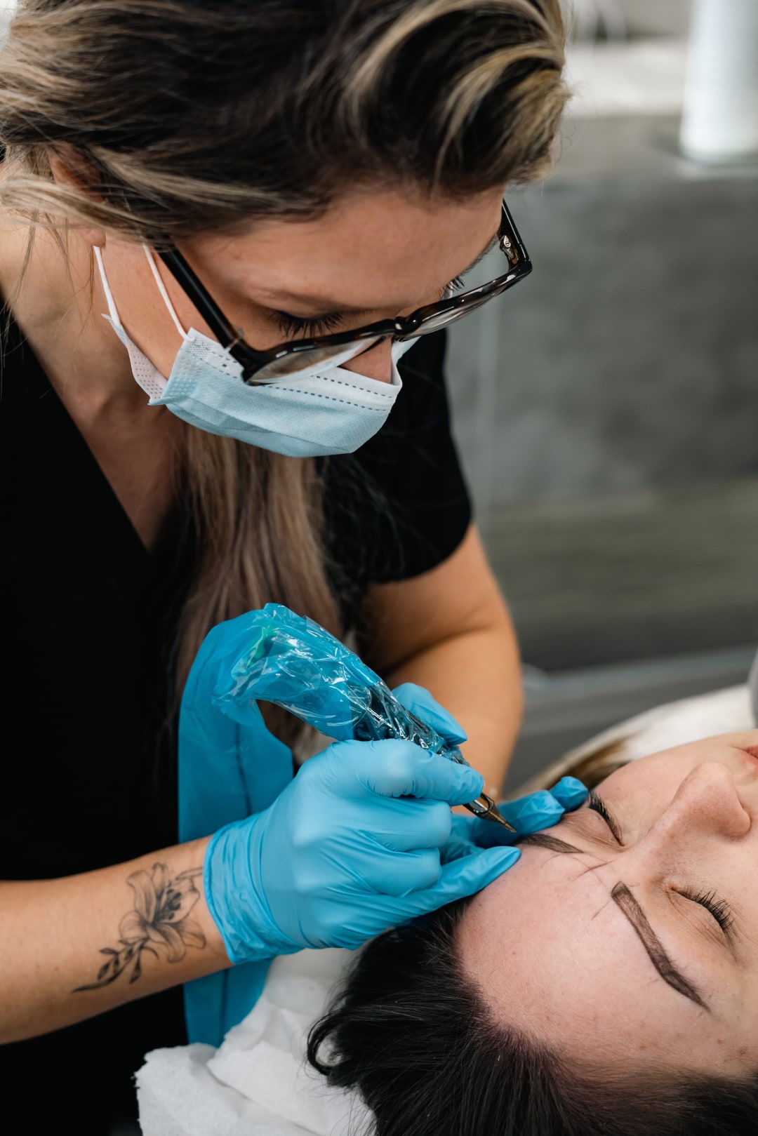 Mary creating hair strokes on a client